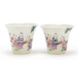 Good pair of Chinese porcelain tea cups hand painted in the famille rose palette with children