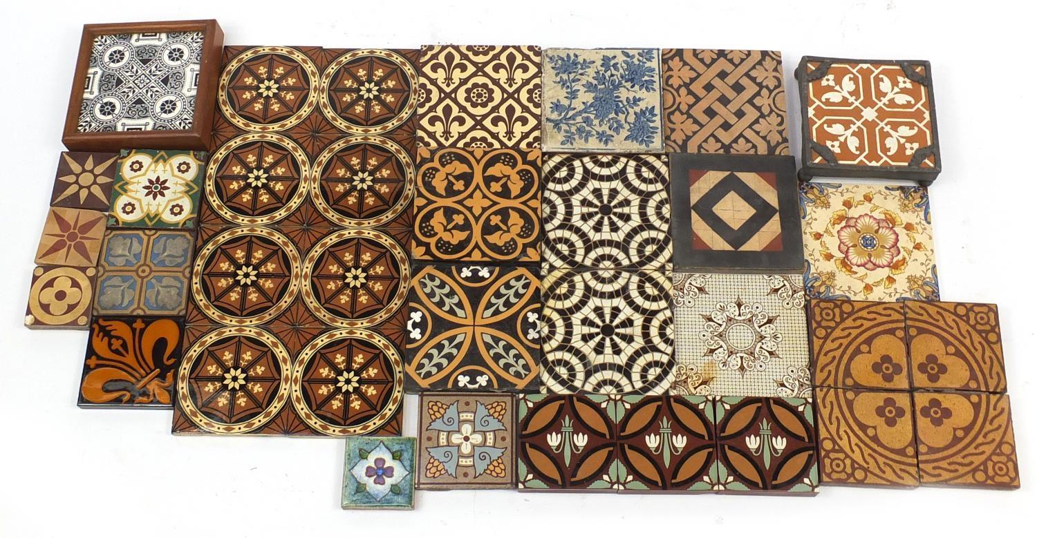 Victorian encaustic tiles including seven by William Godwin, set of eight by Minton and Campbell
