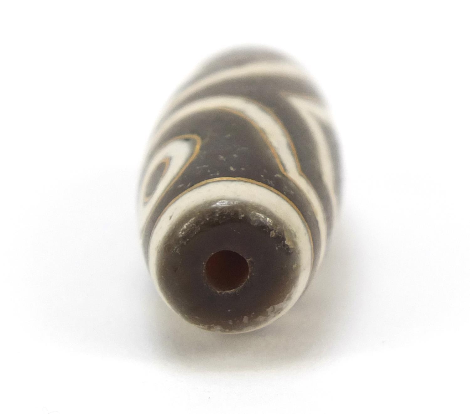 Tibetan dzi bead, 2.5cm wide - Image 4 of 7