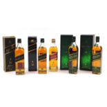 Five bottles of Johnny Walker whiskey, four with boxes comprising two bottles of Black Label 12