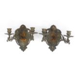 Pair of bronzed cast metal two branch wall sconces, each 22cm high