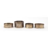 Four silver napkin rings, some with engine turned decoration, various hallmarks, 78.4g