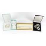 Six silver necklaces including two gold plated housed in gift boxes, 33.8g