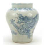 Korean blue and white porcelain dragon jar, hand painted with a dragon chasing a flaming pearl