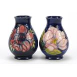 Two Moorcroft baluster vases hand painted with stylised flower heads, each 9.5cm high