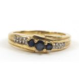 9ct gold sapphire and diamond crossover ring, size P, 3.2g