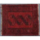 Rectangular Persian red ground rug, 119cm x 101cm
