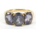9ct gold purple stone trilogy ring, possibly iolite, size O, 2.9g
