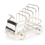 Novelty silver plated toast rack in the form of a car with rotating wheels, 16cm in length