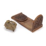 Indian hardwood extending book slide carved with flowers and a brass letter box/door knocker, the