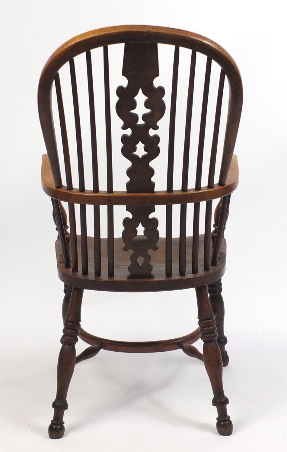 Victorian elm Windsor chair with crinoline stretcher, 106cm high - Image 4 of 4