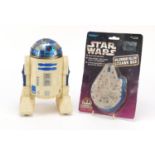 1970's Star Wars R2-D2 action figure and a 1997 Millennium Falcon Squawk Box