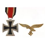 German military interest Iron Cross and a Luftwaffe cap badge, PROVENANCE: Purchased by the vendor
