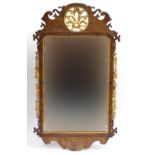 Georgian partially gilt walnut wall mirror with bevelled pate, carved with flowers, leaves and