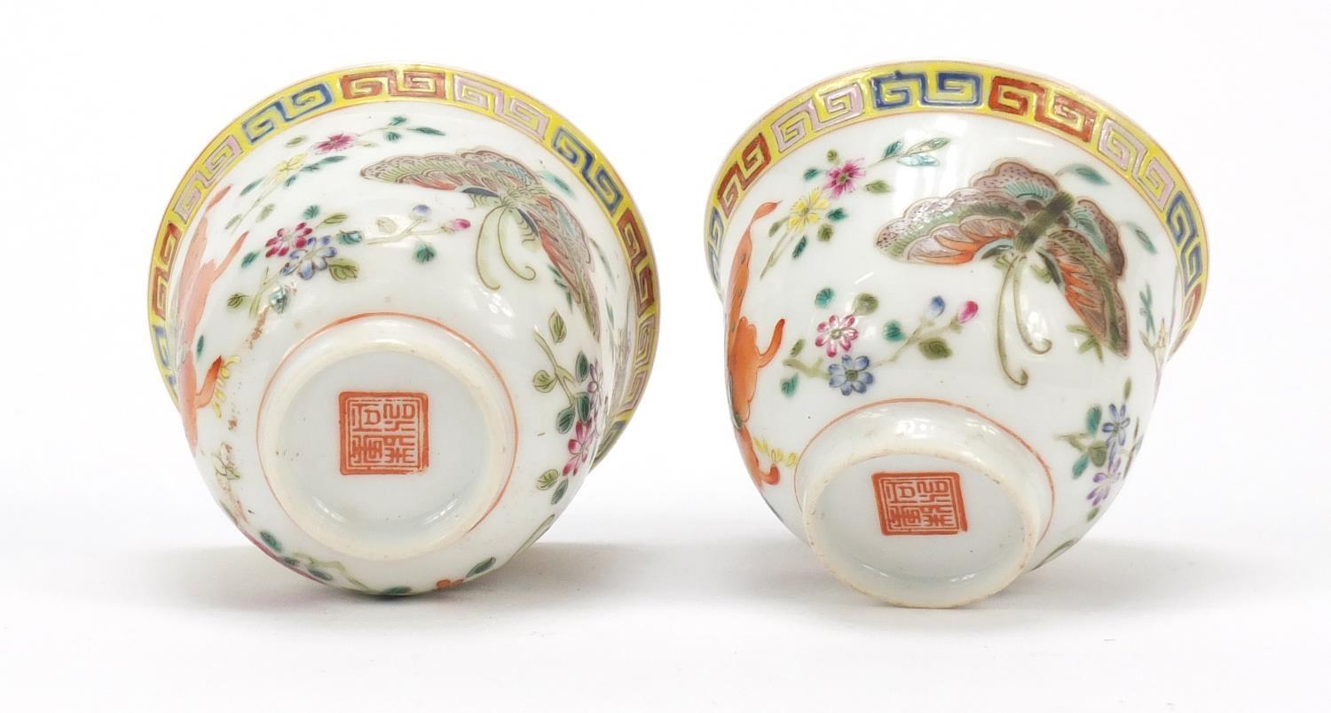 Pair of Chinese porcelain tea cups, each finely hand painted in the famille rose palette with - Image 6 of 10