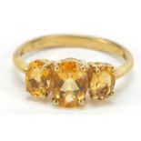 9ct gold orange three stone ring, size O, 2.3g