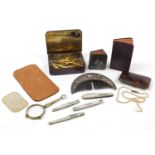 Objects including a faux tortoiseshell cigarette case, Georgian design comb, mother of pearl flanked