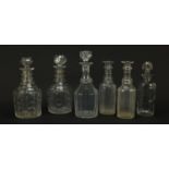 Six Georgian glass decanters including two pairs, the largest 28.5cm high
