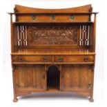 Liberty & Co, Arts & Crafts oak sideboard with embossed copper panels and Ruskin type cabochon