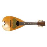 Eight string melon shaped mandolin with case, inscribed Jupiter to the interior, 58.5cm in length