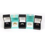 Five silver rings set with semi precious stones housed in gift boxes, various sizes, 25.0g