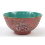 Chinese porcelain bowl hand painted in the famille rose palette with flowers, six figure character