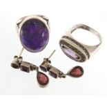Two silver amethyst rings and a pair of silver garnet drop earrings, 22.6g
