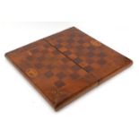 19th century mahogany and yew folding chess and backgammon board, inlaid with ferns, lyres and