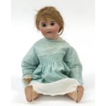 Limoges bisque headed doll with jointed limbs, impressed A9 to the back of the head, 51cm high