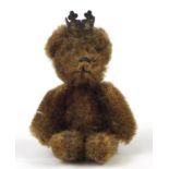 Miniature golden teddy bear with jointed limbs, 6.5cm high