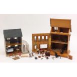 Two hand built wooden doll's houses with contents, the largest 40cm high