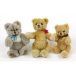 Three Steiff teddy bears, the largest with articulated limbs and growler, 30cm high