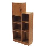 Heal's, Art Deco limed oak open bookcase with cupboard, inset Heal's plaque to the reverse, 109cm