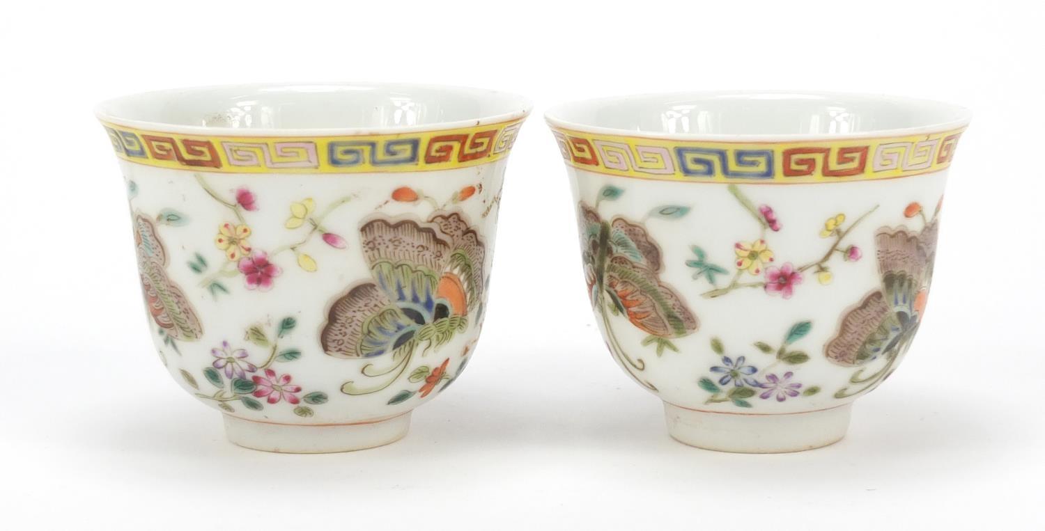 Pair of Chinese porcelain tea cups, each finely hand painted in the famille rose palette with - Image 3 of 10