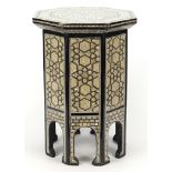 Syrian ebonised octagonal occasional table with mother of pearl geometric foliate inlay, 50cm high x