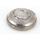 Persian silver snuff box, the hinged lid embossed with a bird of paradise, impressed marks to the