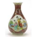 Chinese porcelain vase hand painted in the famille rose palette with figures onto a floral ground,