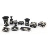 Wedgwood black Jasperware including vases and a pair of pots with covers, the largest 14cm high