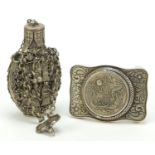 Chinese silver coloured metal snuff bottle and buckle, the largest 9cm high