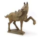 Large Chinese pottery model of a Tang horse, 57cm high x 57cm in length