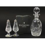 Waterford Crystal comprising a Lismore pattern decanter and salt and pepper sifters with box, the