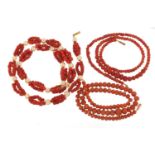 Three coral bead necklaces with 9ct gold clasps, the largest 40cm in length, total 52.6g