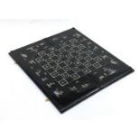 Chinese black lacquered folding games board with mother of pearl inlay, 64cm x 57cm when open