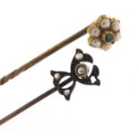 Two Victorian unmarked gold stick pins set with diamonds, seed pearls and emeralds, 6cm in length,
