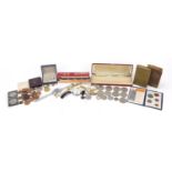 Objects including a Golden Butterfly harmonica and British coinage