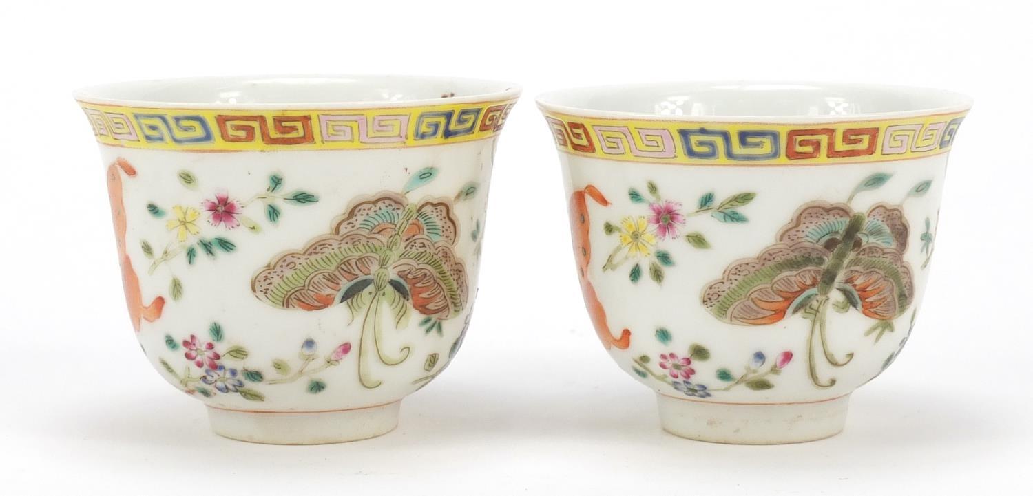 Pair of Chinese porcelain tea cups, each finely hand painted in the famille rose palette with - Image 2 of 10