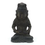 Chinese patinated bronze figure of Buddha holding a teapot, 18.5cm high