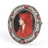 Continental filigree silver portrait brooch depicting a young female, 3.6cm high, 9.6g