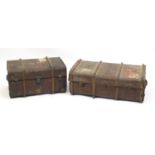 Two vintage wooden bound travelling trunks with leather handles, the largest 90cm wide