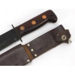 Military interest hunting knife with leather sheath, impressed crow's foot and numbered 87 to the